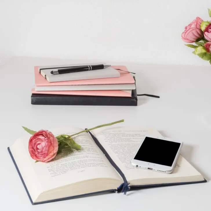 book on a white wooden table