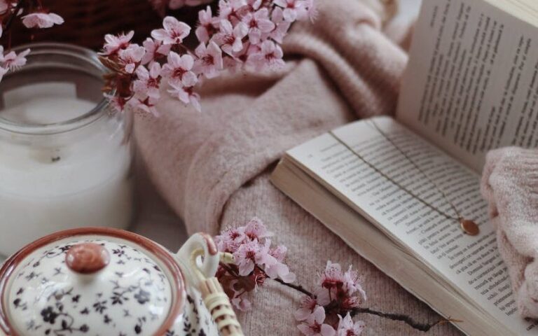book and cup of tea in cozy room